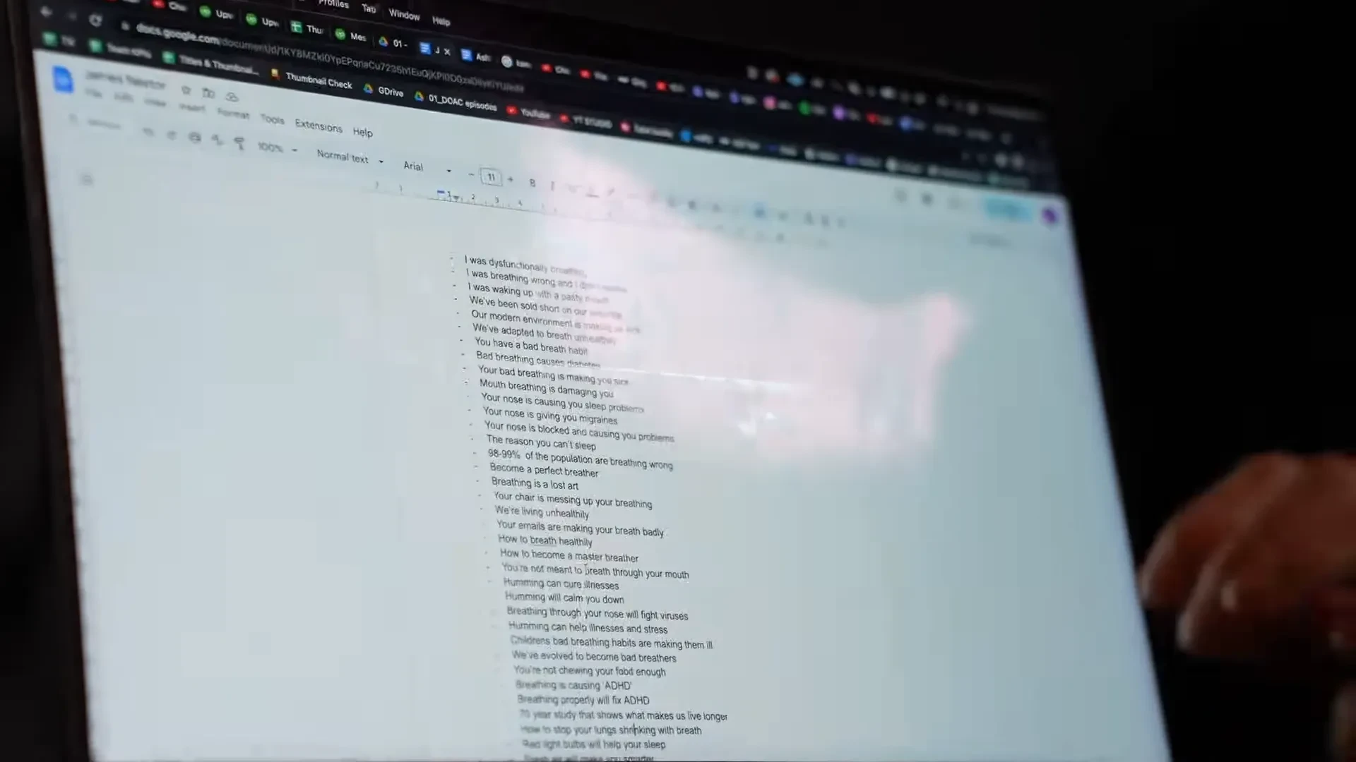 A researcher reviewing a long document on a computer screen.