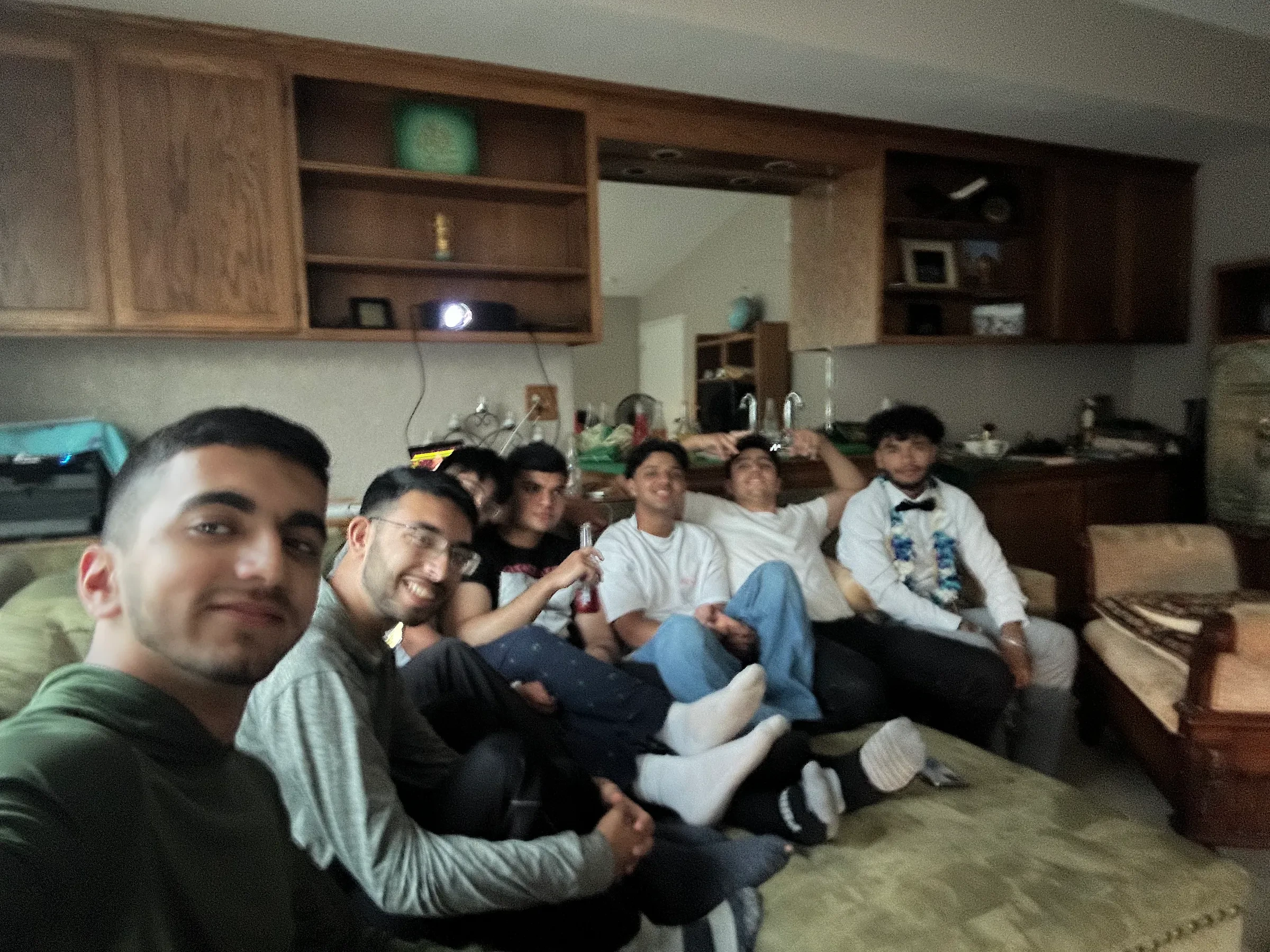 A group of friends sitting together on a couch.