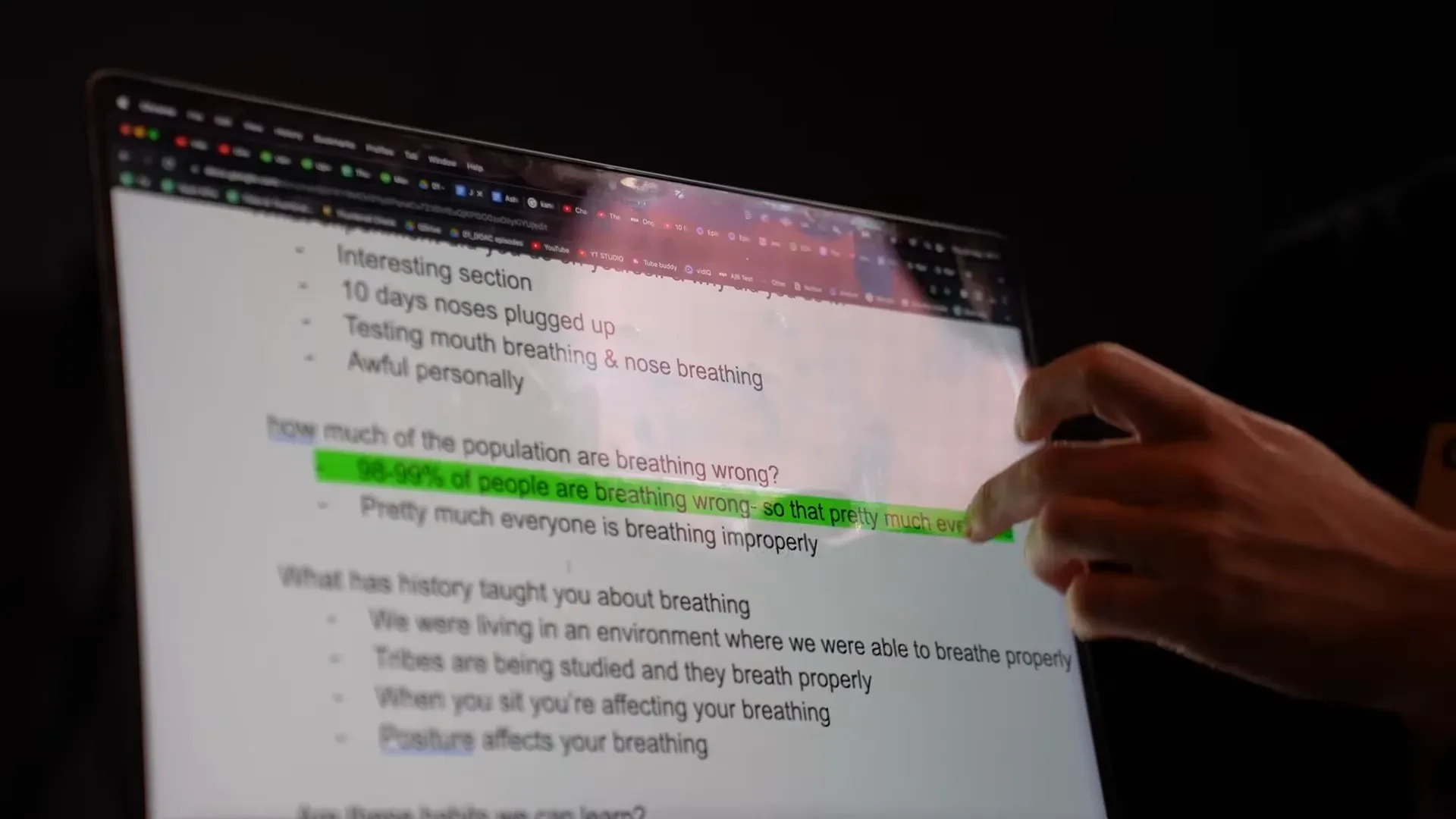A hand pointing to highlighted questions in an interview-preparation document.